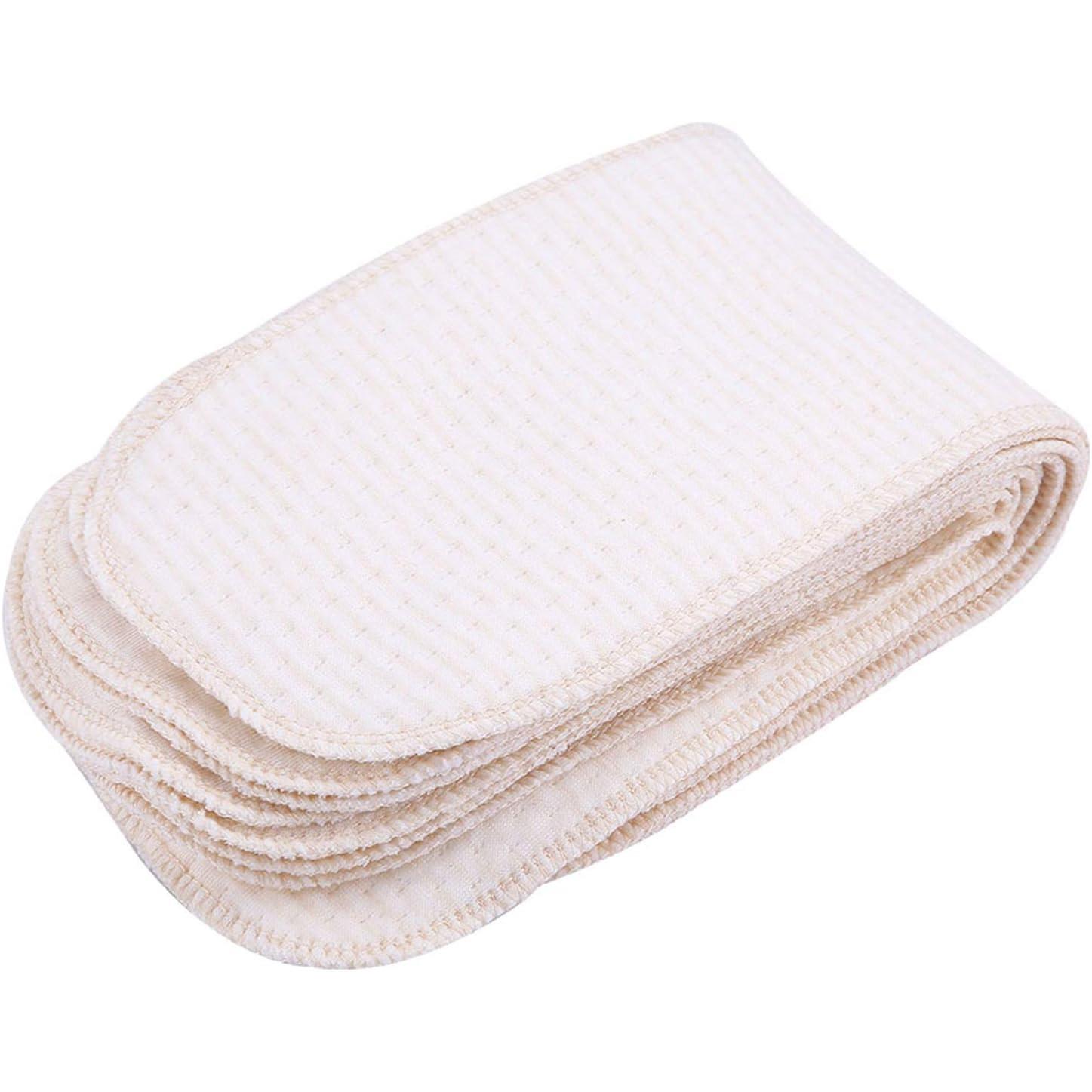 Neat folded stack of natural cream cotton cloth nappy liners on a white background